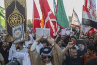 Pendukung ulama muslim Syiah Muqtada al-Sadr menggelar protes di Basra, Irak, Kamis (20/7/2023) pagi. Hal ini dilakukan sebagai bentuk protes pembakaran Al-Quran di Swedia. (AP PHOTO)