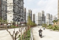 Krisis properti menghantam China. Jutaan rumah kosong, meskipun penduduk mencapai miliaran. (©Qilai Shen/Bloomberg | A development in Shanghai)