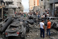 Militer Israel menggempur Jalur Gaza dengan rentetan serangan udara, dan secara resmi menyatakan perang terhadap Hamas pada Minggu (8/10/2023) waktu setempat. (Reuters/Mohammed Salem)