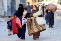 


Pengungsi Palestina melarikan diri ke Rafah, di Gaza selatan, setelah serangan udara Israel. | AFP-JIJI