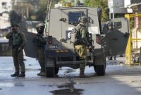 Tentara Israel terlihat saat operasi militer di Jenin, Tepi Barat, Rabu (13/12/2023). (AP Photo/Majdi Mohammed)