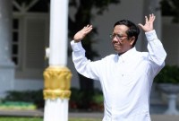 Mahfud MD merasa pengunduran dirinya dari Menko Polhukam sebagai bentuk etika. Namun, ia enggan menyinggung orang lain yang masih menjabat di kabinet. [ANTARA FOTO/Wahyu Putro A]