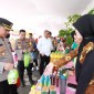 Bakti sosial (baksos) dan pembagian bantuan sosial (bansos) di halaman Mapolsek Banjarmasin Utara, Selasa (23/6/24). (SuarIndonesia/YI)