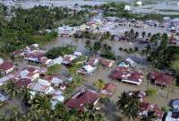 Foto udara banjir menggenangi rumah warga di Telaga Jaya, Kabupaten Gorontalo, Gorontalo, Sabtu (13/7/2024) lalu. [ANTARA FOTO/Adiwinata Solihin]