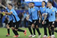 Pemain Uruguay selebrasi usai adu penalti dengan skor 4-3 (2-2) atas Kanada. Uruguay pun memastikan finis di peringkat ketiga Copa America 2024, Minggu (14/7/2024). [GRANT HALVERSON/GETTY IMAGES NORTH AMERICA/Getty Iamges via AFP]