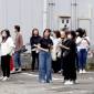 Orang-orang berlindung di luar gedung setelah gempa bumi di Miyazaki, Jepang bagian barat, Kamis (8/8/2024). (Kyodo News via AP)