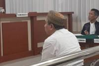 terdakwa notaris berinisial AS pada waktu sidang (SuarIndonesia/Ist)