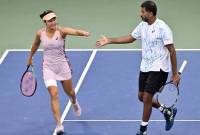 Petenis terbaik Indonesia, Aldila Sutjiadi yang berpasangan dengan petenis India, Rohan Bopanna sukses menembus babak semifinal nomor ganda campuran turnamen tenis Grand Slam US Open 2024 usai menaklukkan unggulan keempat yang berstatus juara Grand Slam yang juga peraih medali emas Olimpiade, Barbora Krejcikova/Matthew Ebden pada babak perempat final di court 5 USTA Billie Jean King National Tennis Center, New York City, Amerika Serikat, Selasa (3/9/2024) dini hari WIB. (Athletica Company/Chryslene Caillaud)
