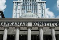 Mahkamah Konstitusi (MK) menolak gugatan terhadap aturan batas waktu penyelesaian penataan pegawai honorer (cleansing) dari instansi pemerintah yang tertuang dalam Undang-Undang Nomor 20 Tahun 2023 tentang Aparatur Sipil Negara (ASN). (AFP/YASUYOSHI CHIBA)