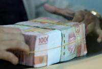 Foto Ilustrasi. Kejaksaan Agung menyita barang bukti uang tunai dan sejumlah barang elektronik dari para tersangka suap dan gratifikasi terkait vonis bebas Ronald Tannur (REUTERS/WILLY KURNIAWAN)