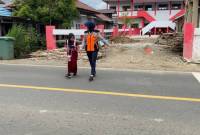 Tim Dispasus saat melakukan pengamanan titik rawan lalu lintas di kecamatan.- Foto: Mc.Balangan