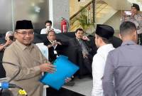 Mantan Menteri Agama Yaqut Cholil Qoumas (kiri) saat tiba di Gedung Merah Putih KPK, Jakarta, Kamis (7/8/2025). (ANTARA/Rio Feisal)