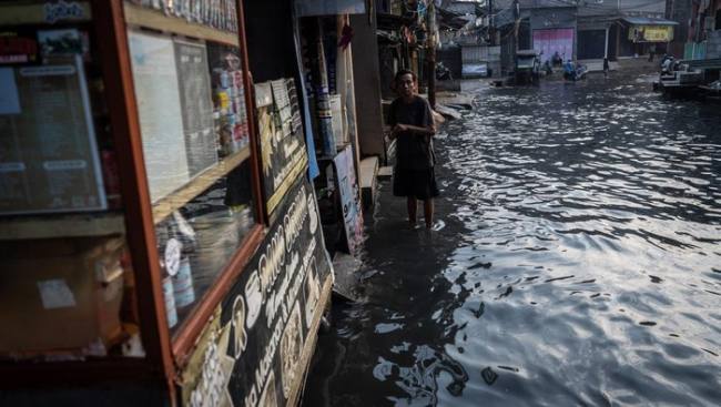Foto Ilustrasi banjir pesisir. (Foto: Antara Foto/Bayu Pratama S)
