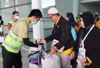 Kedatangan jamaah haji Kloter 11 Debarkasi Banjarmasin asal Kabupaten Hulu Sungai Utara (HSU) di Bandara Internasional Syamsuddin Noor Banjarmasin setelah melaksanakan ibadah haji 2026, Jumat (19/6/2026). (Foto: PPIH Debarkasi Banjarmasin)