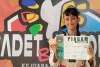 Siswi SDN 2 Sidorejo, Pangkalan Bun, bernama Dewi Putri raih medali perunggu di Kejurnas Taekwondo. (Foto: Dok Istimewa)
