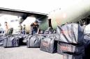 Bantuan Kemenhan dan Puskes TNI AU yang dibawa pesawat Hercules TNI Angkatan Udara A-1328 dan tiba di Apron Lanud Sjamsudin Noor. (Foto: HO-Antara)